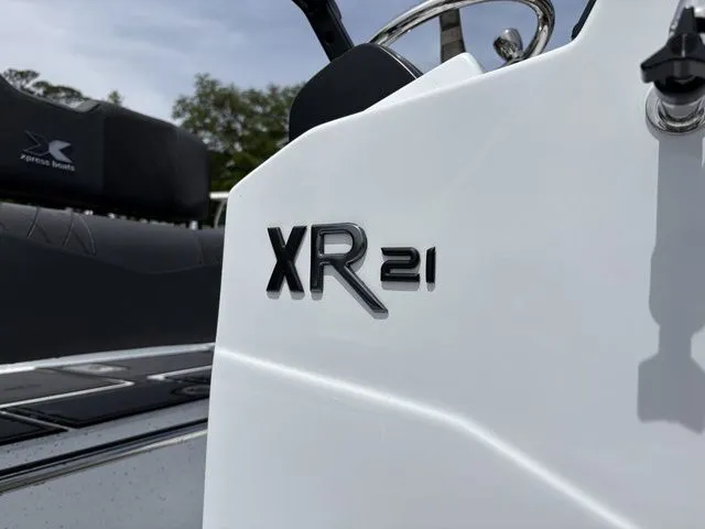 Slide: The Image of Close-up of Xpress Boats XR21B 2026 emblem on white boat. - 31
