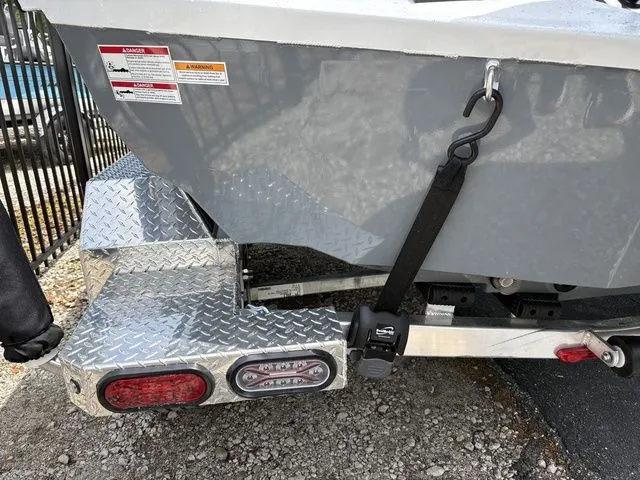 Slide: The Image of 2026 Xpress Boats XR21B trailer with safety strap and taillights. - 32