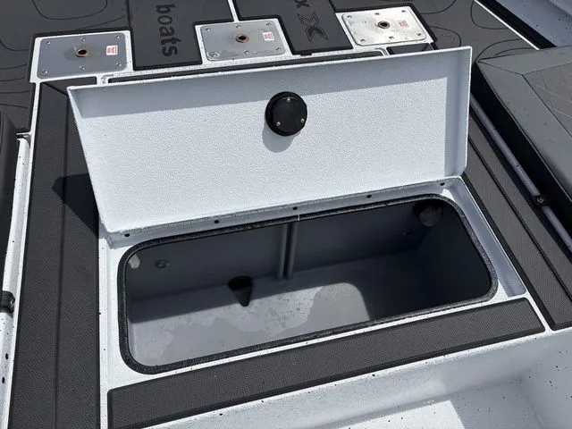 Slide: The Image of Open storage compartment on a 2026 Xpress Boats XR21B. - 7