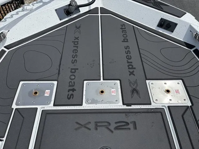 Slide: The Image of Deck of Xpress Boats XR21B 2026 with branding logo. - 9