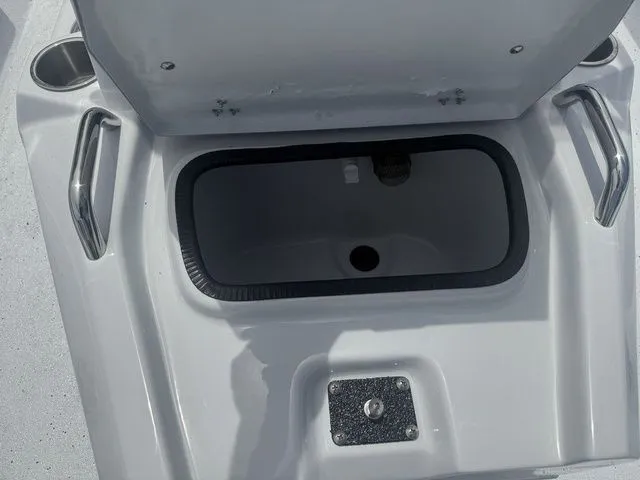 Slide: The Image of Open storage compartment on a 2026 Xpress Boats H20B model. - 14