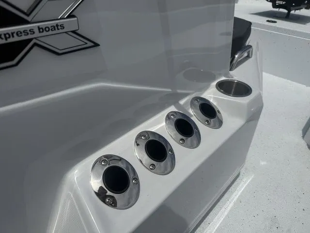Slide: The Image of Close-up of fishing rod holders on a 2026 Xpress Boats H20B model. - 15