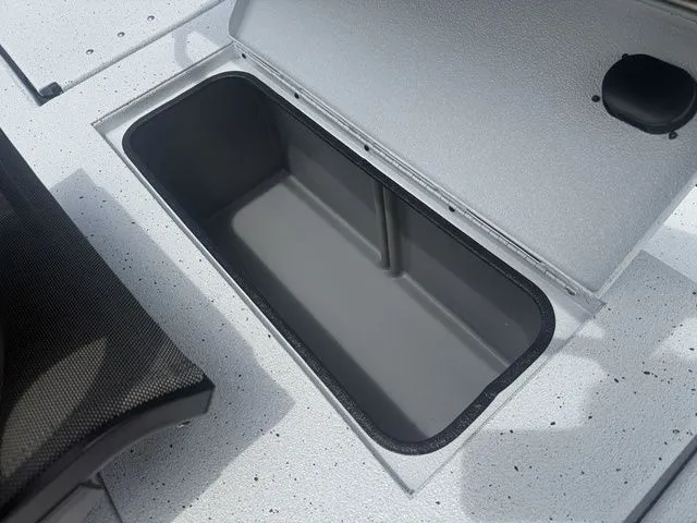 Slide: The Image of 2026 Xpress Boats H20B storage compartment with open lid. - 19
