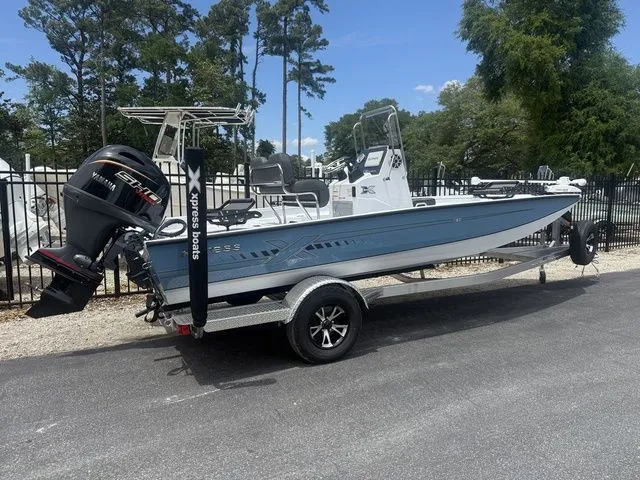 Slide: The Image of 2026 Xpress Boats H20B on trailer, blue hull, outboard motor. - 4