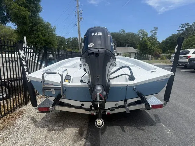 Slide: The Image of Rear view of a 2026 Xpress Boats H20B with outboard motor. - 5