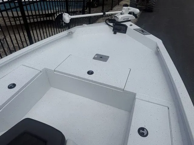 Slide: The Image of 2026 Xpress Boats H20B front deck with storage and controls. - 7