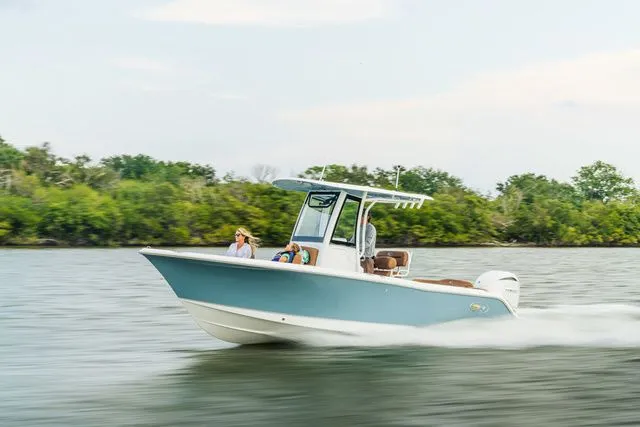 Slide: The Image of 2026 Sea Hunt Ultra 235 SE boat cruising on water. - 3