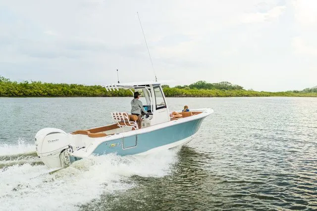 Slide: The Image of Sea Hunt Ultra 235 SE 2026 cruising on calm waters. - 4