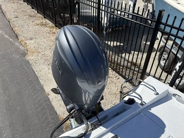 Slide: The Image of 2026 Xpress Boats H20B with outboard motor, side view. - 15