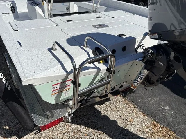 Slide: The Image of Rear view of 2026 Xpress Boats H20B with motor and ladder. - 16
