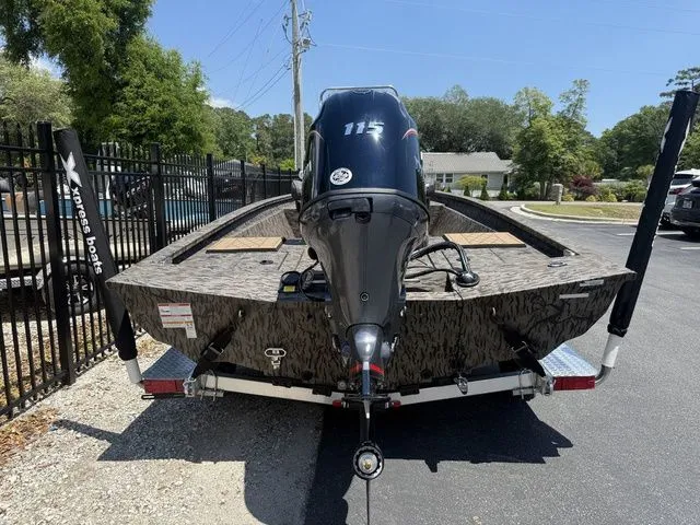 Slide: The Image of 2026 Xpress Boats H190B with outboard motor on trailer. - 5