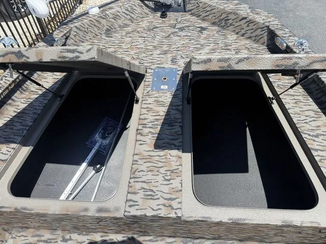 Slide: The Image of 2026 Xpress Boats H190B with open storage compartments. - 9