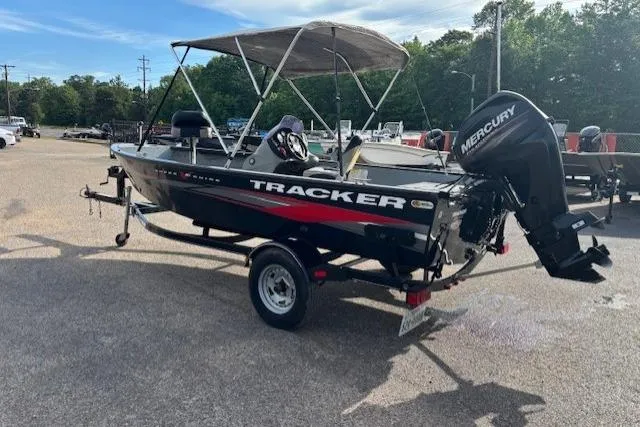 Slide: The Image of 2013 Tracker Super Guide V-16 SC boat with Mercury outboard motor on trailer. - 2