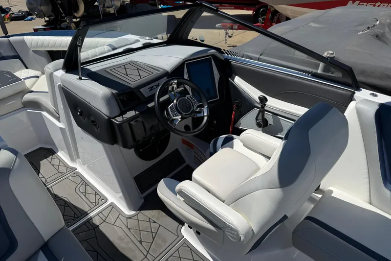Slide: The Image of 2022 Tigé 21ZX boat interior with modern dashboard and comfortable seating. - 11