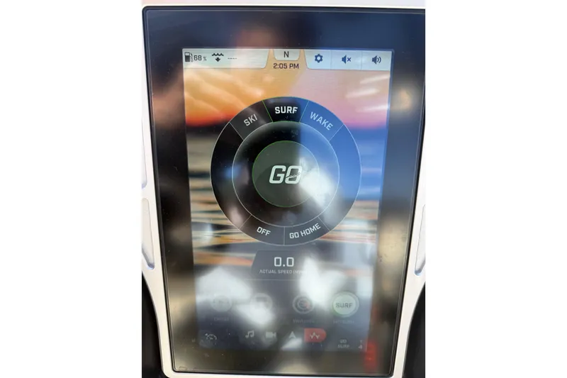 Slide: The Image of Touchscreen display of a 2022 Tigé 21ZX boat showing ski, surf, and wake modes. - 18