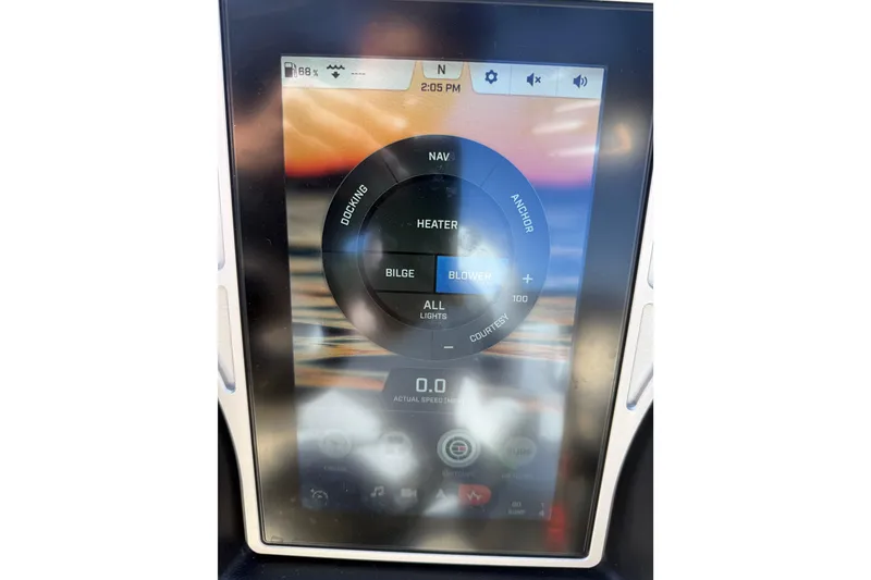 Slide: The Image of Touchscreen control panel of a 2022 Tigé 21ZX boat displaying navigation and system settings. - 19