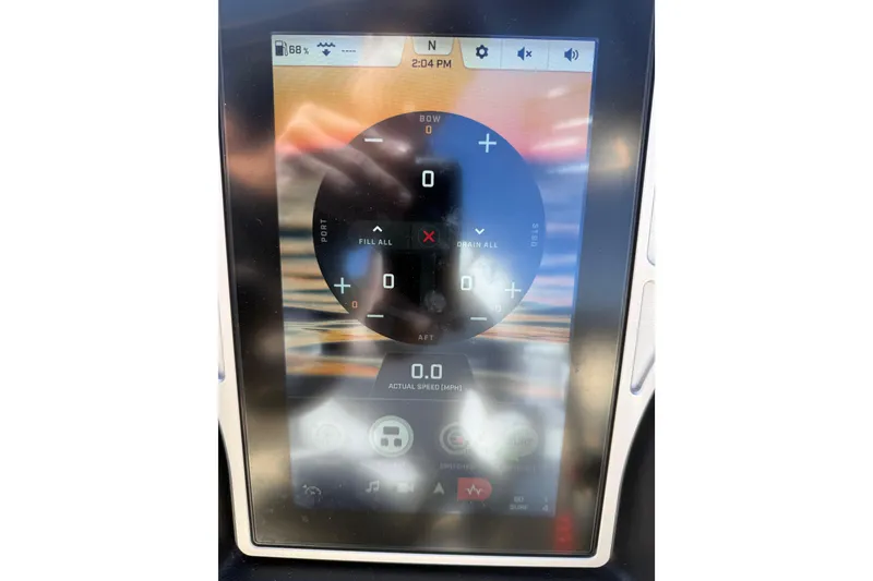 Slide: The Image of Touchscreen display of a 2022 Tigé 21ZX boat showing control settings and speed. - 20