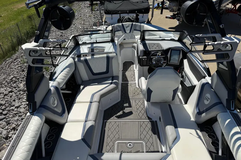 Slide: The Image of 2022 Tigé 21ZX boat interior with modern seating and advanced dashboard controls. - 22