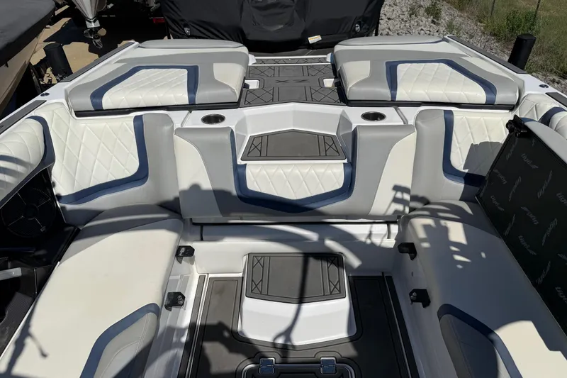 Slide: The Image of 2022 Tigé 21ZX boat interior with stylish seating and modern design. - 26