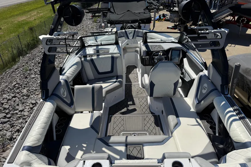 Slide: The Image of 2022 Tigé 21ZX boat interior with modern seating and advanced dashboard features. - 27