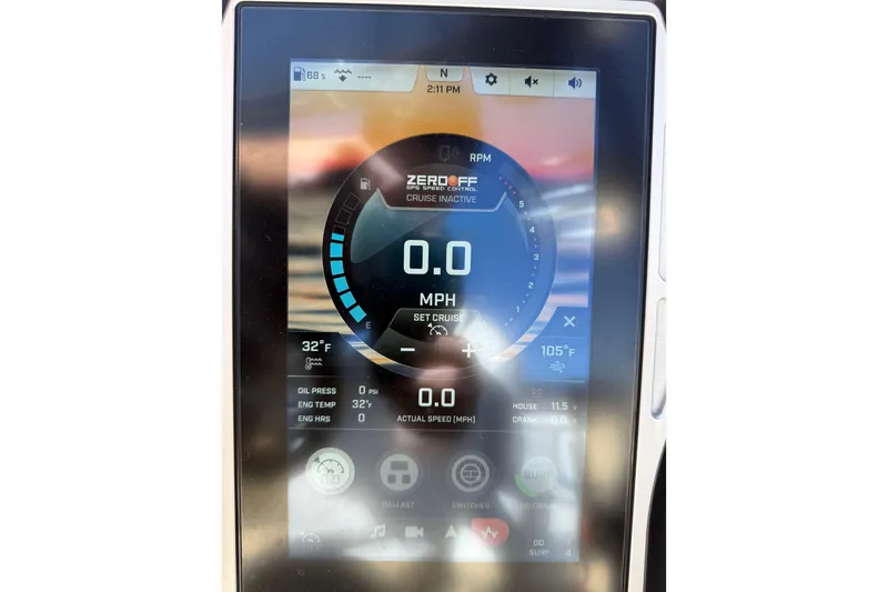 Slide: The Image of Touchscreen display of a 2022 Tigé 21ZX boat showing speed and engine data. - 32