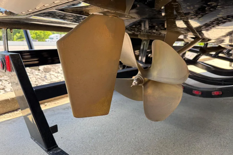 Slide: The Image of Close-up of 2022 Tigé 21ZX boat propeller and rudder on a trailer. - 33