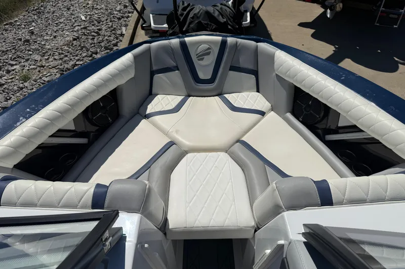 Slide: The Image of 2022 Tigé 21ZX boat interior with luxurious white and blue seating. - 4