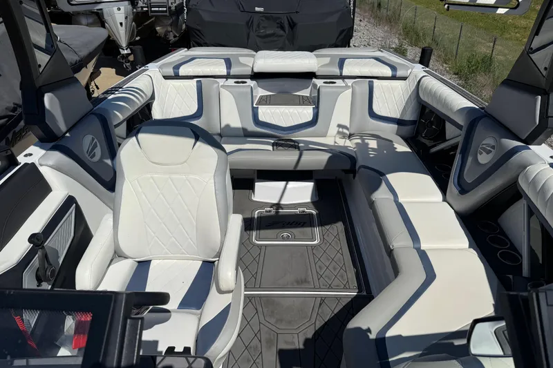Slide: The Image of 2022 Tigé 21ZX boat interior with luxurious white seating and modern design. - 6