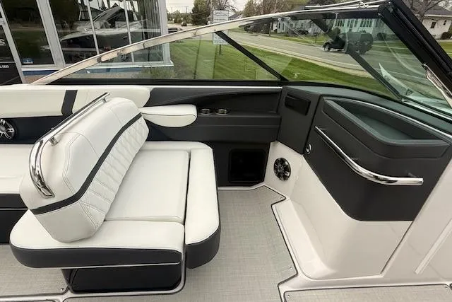 Slide: The Image of Interior of a 2021 Regal 2800 Bowrider boat with white and black seating. - 11