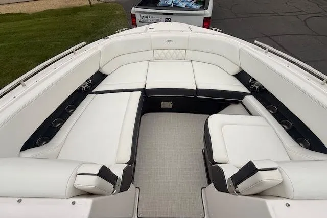 Slide: The Image of 2021 Regal 2800 Bowrider boat with spacious white seating and modern design. - 17