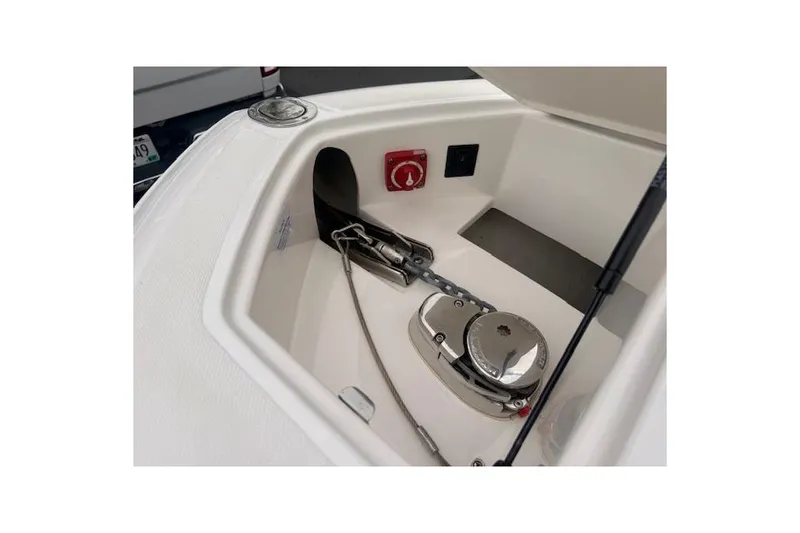 Slide: The Image of 2021 Regal 2800 Bowrider anchor compartment with winch and chain detail. - 22
