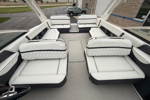 Slide: The Image of Luxurious interior of 2021 Regal 2800 Bowrider with spacious white seating arrangement. - 23