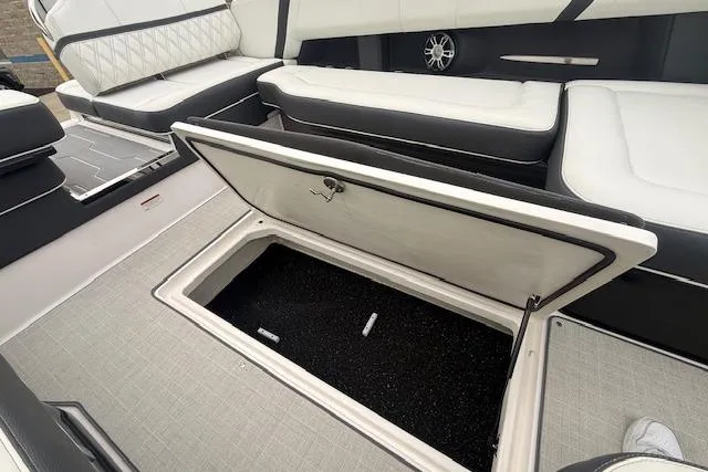 Slide: The Image of 2021 Regal 2800 Bowrider interior with open storage compartment and luxurious seating. - 27