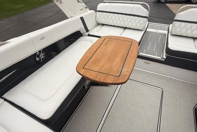 Slide: The Image of Luxurious 2021 Regal 2800 Bowrider interior with elegant seating and wooden table. - 28