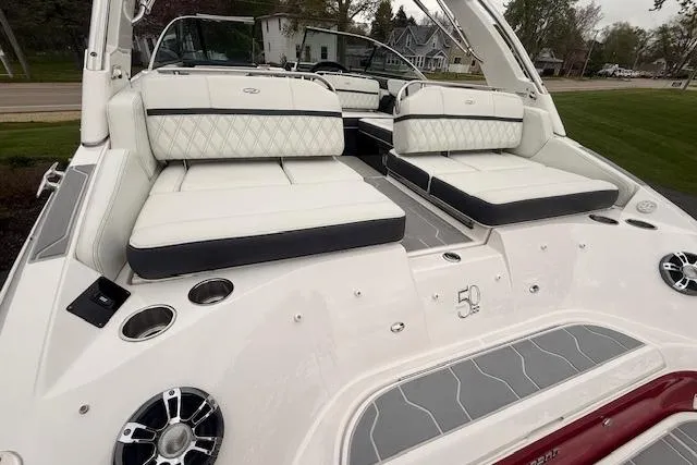 Slide: The Image of 2021 Regal 2800 Bowrider boat with luxurious white seating and modern design. - 32
