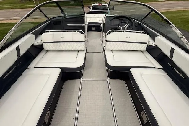 Slide: The Image of 2021 Regal 2800 Bowrider interior with luxurious white seating and sleek design. - 4