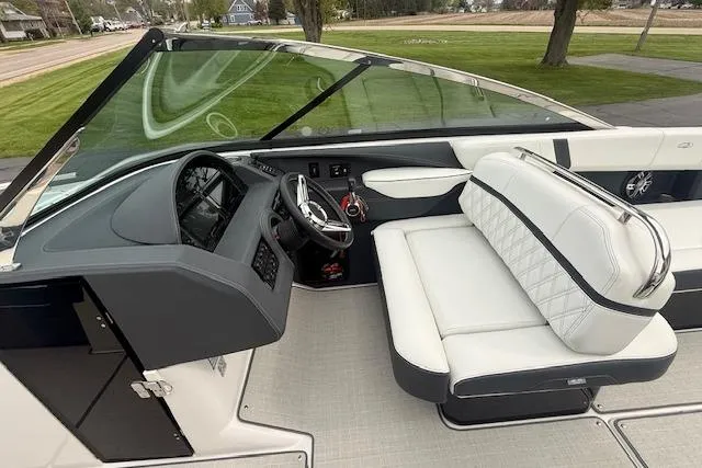 Slide: The Image of 2021 Regal 2800 Bowrider interior with sleek dashboard and luxurious seating. - 5