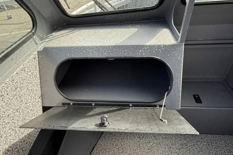 Slide: The Image of Open storage compartment in 2026 Alumaweld Stryker X202 boat, featuring a sleek, modern design. - 11