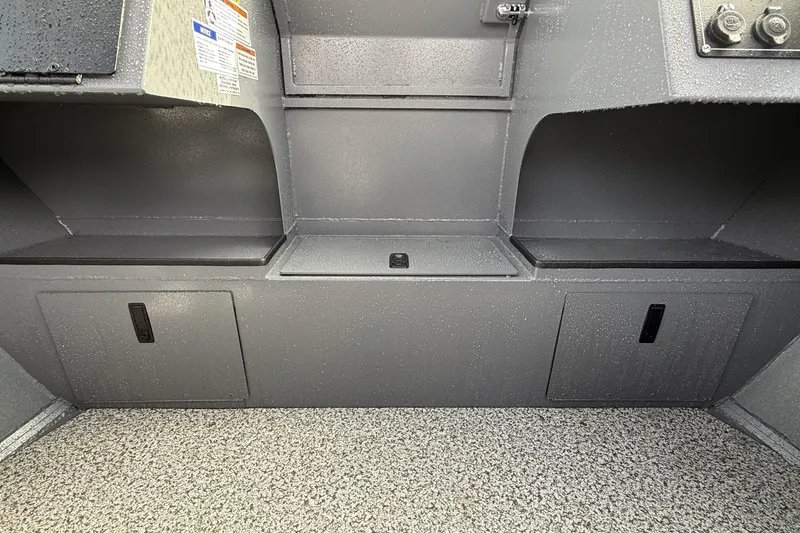 Slide: The Image of Interior view of 2026 Alumaweld Stryker X202 boat, featuring storage compartments and textured flooring. - 17