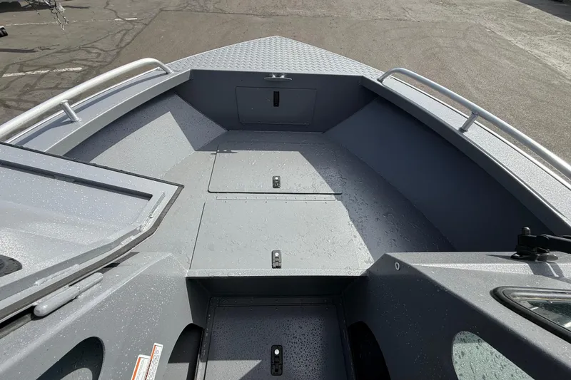 Slide: The Image of 2026 Alumaweld Stryker X202 boat interior with storage compartments and sleek design. - 20