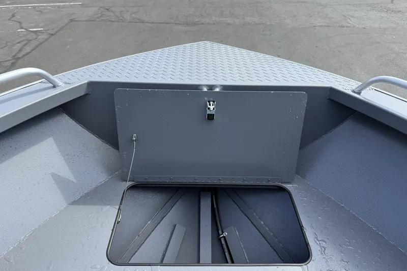 Slide: The Image of 2026 Alumaweld Stryker X202 boat interior with storage compartment and diamond plate flooring. - 22
