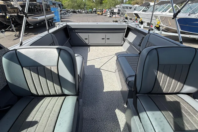 Slide: The Image of 2026 Alumaweld Stryker X202 boat interior with gray seating and spacious layout. - 24