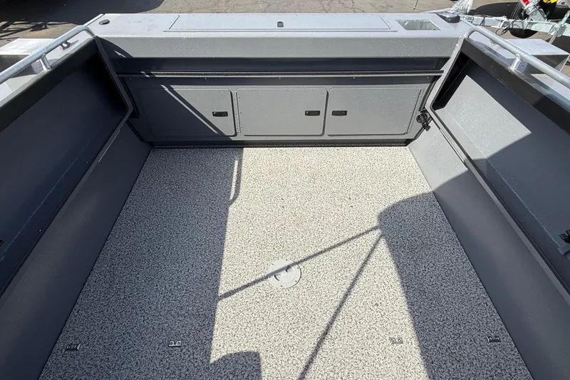 Slide: The Image of 2026 Alumaweld Stryker X202 boat interior with spacious deck and storage compartments. - 26