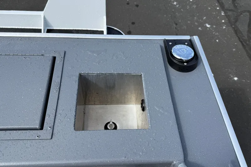 Slide: The Image of 2026 Alumaweld Stryker X202 boat detail showing a compartment and fuel cap on deck. - 30