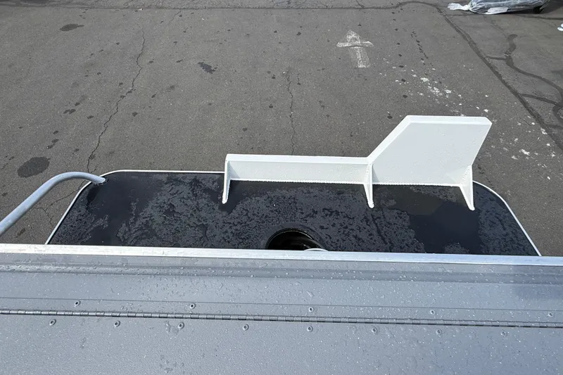 Slide: The Image of 2026 Alumaweld Stryker X202 boat deck with wet surface and white railing. - 31