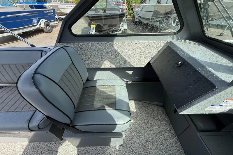 Slide: The Image of 2026 Alumaweld Stryker X202 boat interior with gray seating and dashboard. - 9
