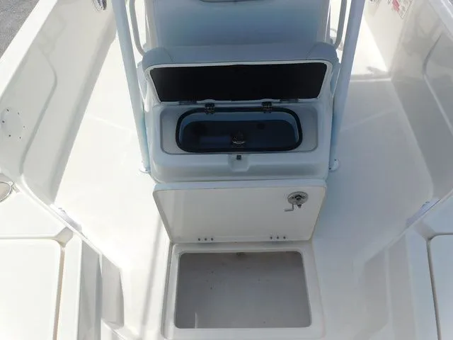 Slide: The Image of 2017 Skeeter SX210 boat with open storage and seating area. - 13