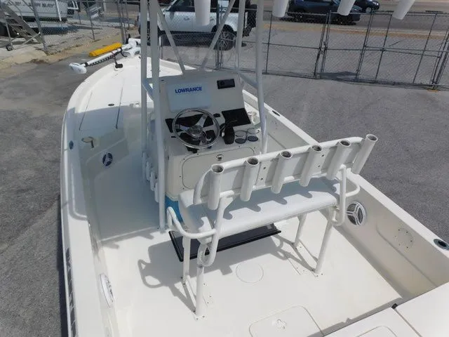 Slide: The Image of 2017 Skeeter SX210 boat with helm console and fishing rod holders. - 7