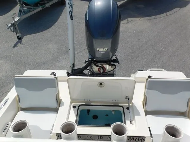 Slide: The Image of Rear view of a 2017 Skeeter SX210 boat with outboard motor. - 8