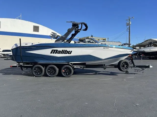 The Image of 2026 Malibu Wakesetter 25 LSV boat on trailer, side view. - 1